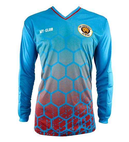 A long-sleeve sports jersey with a blue and red hexagonal pattern, a MY-CLUB label on the left chest, and a yellow lion crest on the right chest. The shirt has a V-neck collar with red trim.