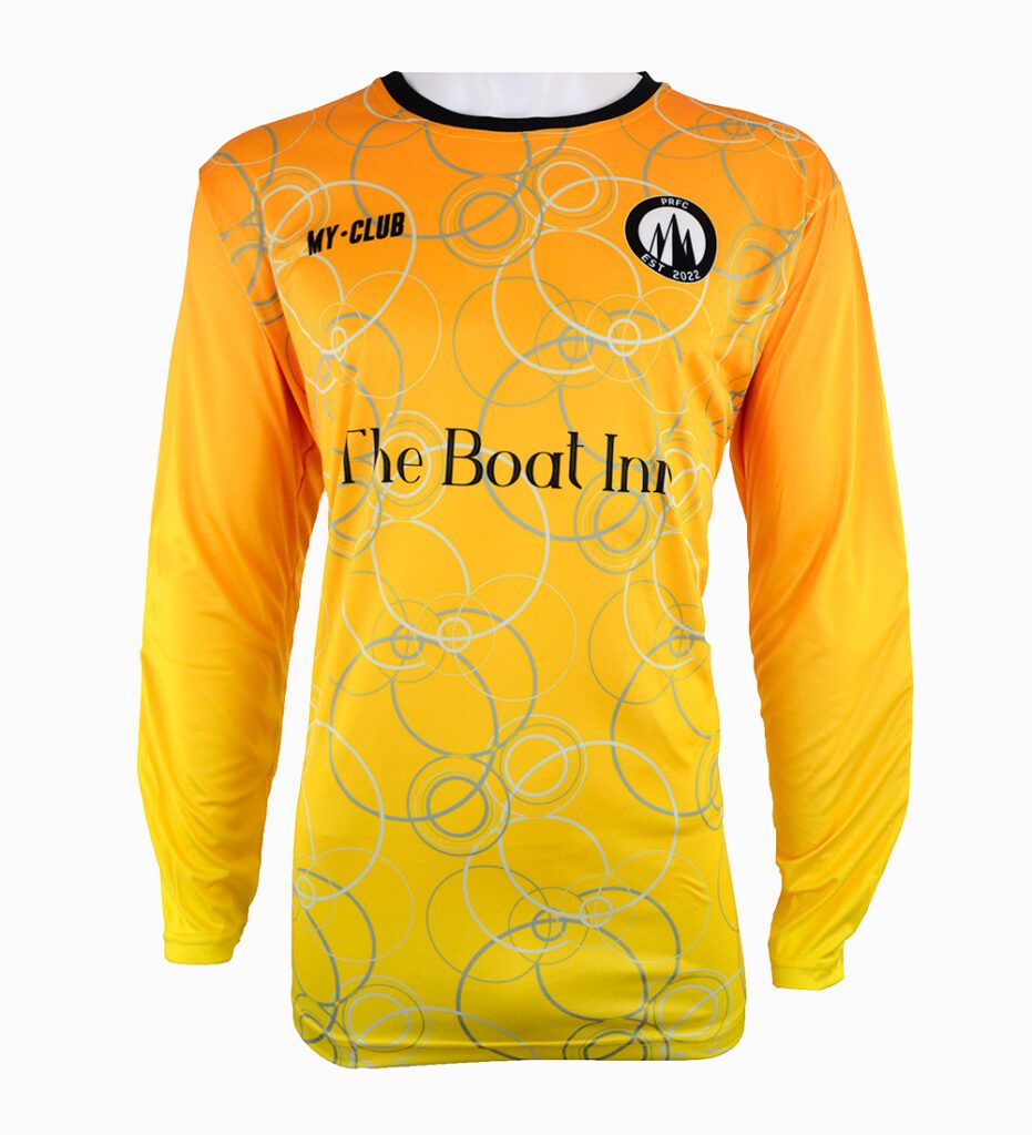 A long-sleeve football shirt in shades of yellow and orange with an abstract circular pattern, featuring MY-CLUB and a logo on the chest, and The Boat Inn written across the front.