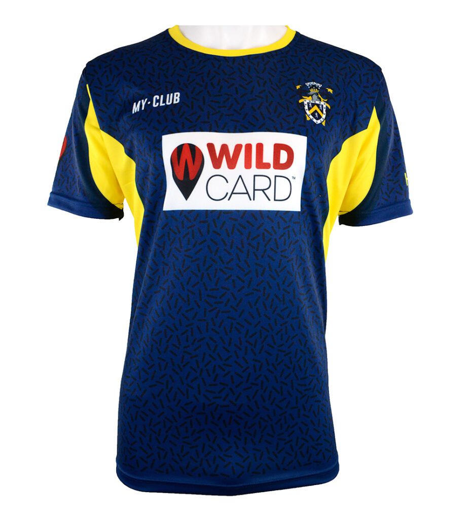 A blue and yellow short-sleeved sports shirt with a WILD CARD logo in red and black on a white background, a MY-CLUB label on the chest, and a crest with a football and shield on the left side.