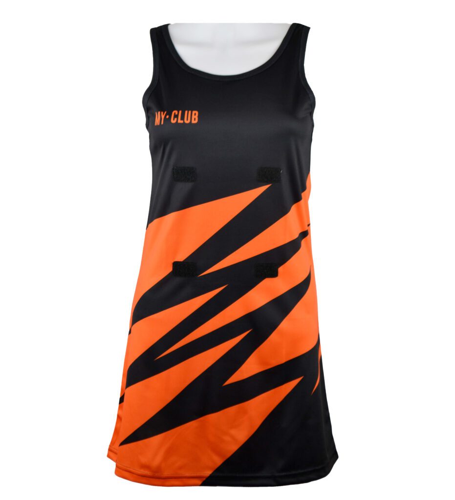 A sleeveless sports dress with bold orange and black diagonal zigzag patterns, the words MY CLUB on the chest, and three horizontal black stripes on the front.