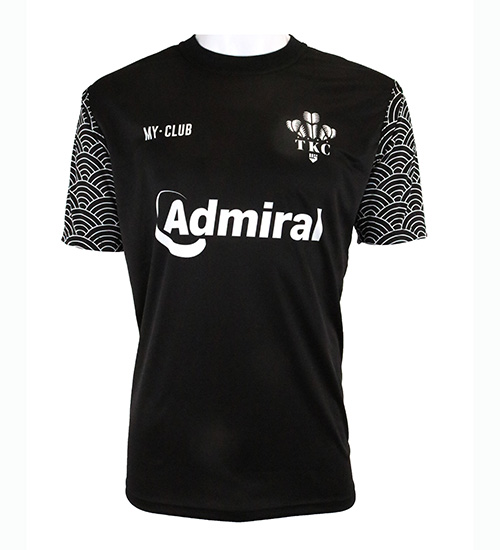 A black short-sleeve sports shirt with Admiral written in white on the front, a TKC logo above, MY CLUB on the left chest, and patterned black-and-white sleeves. The shirt is displayed on a white mannequin torso.