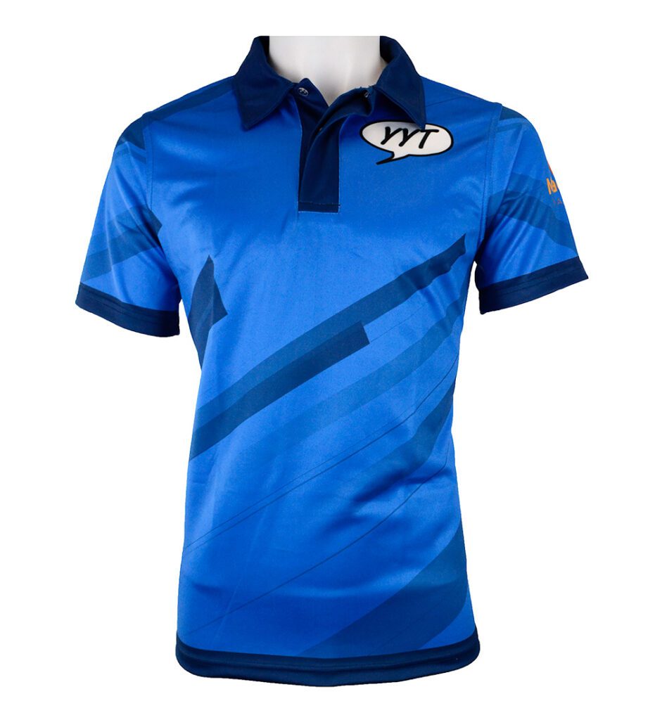 A blue short-sleeved polo shirt with geometric dark blue patterns, a collar, and buttons. There is a white speech bubble with YMT on the left chest and a small yellow logo on the left sleeve.